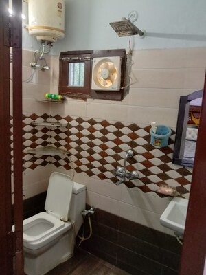 Bedroom in 2 BHK Builder Floor at Dharam Flats, Palam Vihar Extension – for Rent