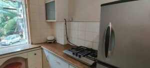 Kitchen in 2 BHK Apartment at Andheri CHS, Andheri West – for Rent