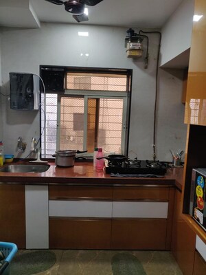 Kitchen in 1 BHK Apartment at Raunak Bliss, Ghodbunder Road – for Rent