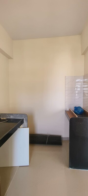 Kitchen in 2 BHK Apartment at Ram Pushpanjali Residency, Owale – for Rent