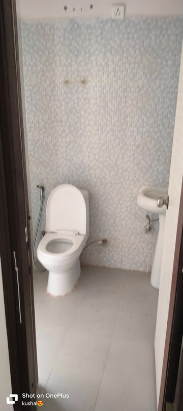 Bathroom in 2 BHK Apartment at Urban Axis Urban Woods, Sushant Golf City – for Rent