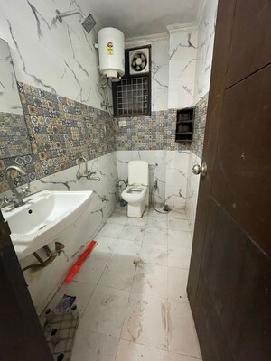Bathroom in 2 BHK Apartment at Chattarpur – for Sale