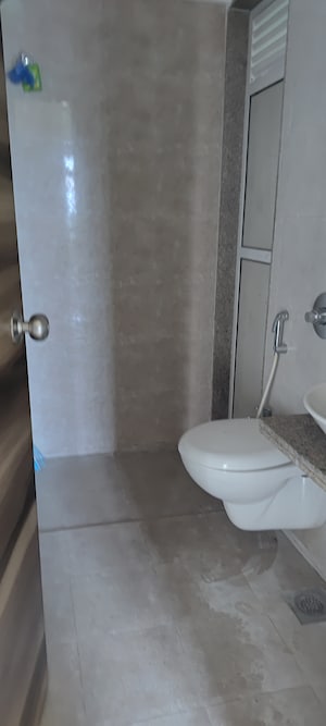 Bathroom in 1 BHK Apartment at Metropolis Aquaris Phase 1, Kasarvadavali – for Rent