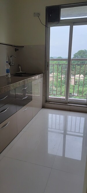 Kitchen in 1 BHK Apartment at Metropolis Aquaris Phase 1, Kasarvadavali – for Rent