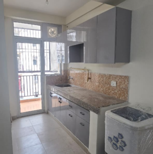 Kitchen in 2 BHK Apartment at Wave City Swamanorath, Ram Nagar – for Rent