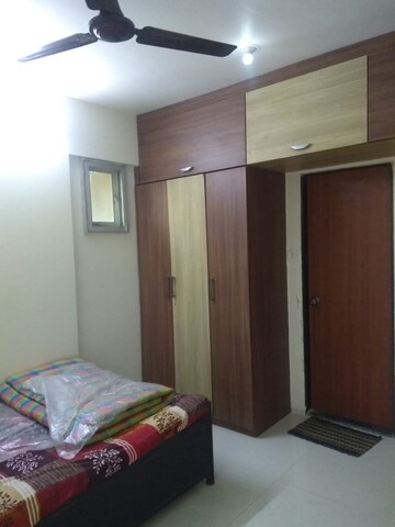 Bedroom in 1.5 BHK Apartment at Nivara Deepanjali CHSL, Vile Parle East – for Rent