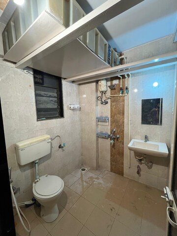 Bathroom in 2 BHK Apartment at Nivara Deepanjali CHSL, Vile Parle East – for Rent