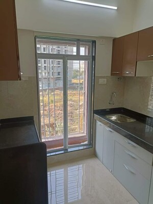 Kitchen in 2 BHK Apartment at Umiya Oasis, Mira Road – for Sale