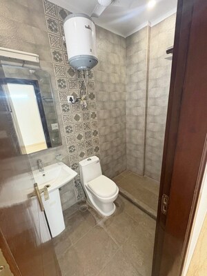 Bathroom in 2 BHK Builder Floor at Kalkaji – for Rent
