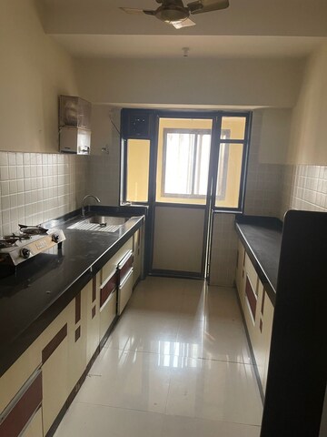 Kitchen in 3 BHK Apartment at Evershine Cosmic, Andheri West – for Rent