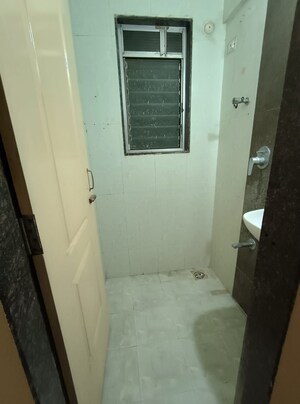 Bathroom in 1 BHK Apartment at Kopar Khairane – for Rent