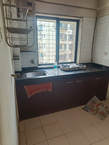 Kitchen in 1 BHK Apartment at Veena Sur CHS, Kandivali West – for Sale