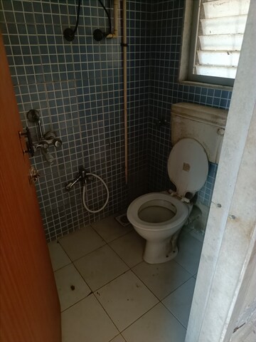 Bathroom in 1 BHK Apartment at Veena Sur CHS, Kandivali West – for Sale
