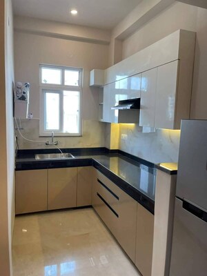 Kitchen in Studio Builder Floor at Ambience Mall, Sector 24 – for Rent