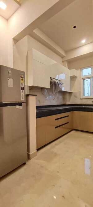 Kitchen in Studio Builder Floor at Ambience Mall, Sector 24 – for Rent