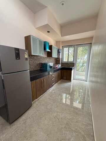 Kitchen in Studio Builder Floor at Ambience Mall, Sector 24 – for Rent