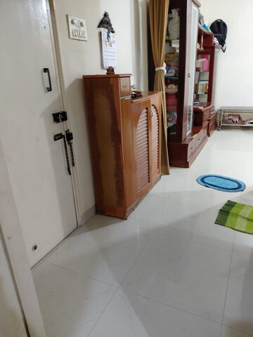 Living Room in 1 BHK Apartment at K Raheja Palm Spring, Malad West – for Rent
