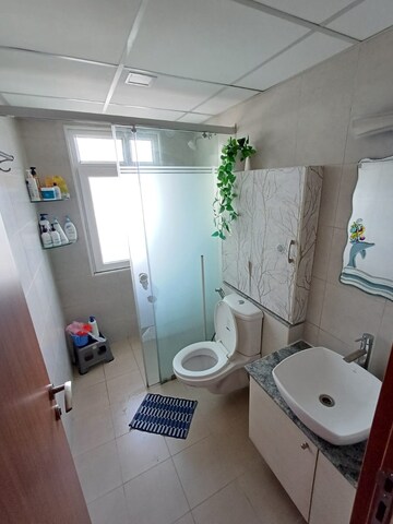 Bathroom in 3 BHK Apartment at Bhartiya Nikoo Homes Phase 2, Thanisandra Main Road – for Sale