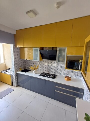 Kitchen in 3 BHK Apartment at Bhartiya Nikoo Homes Phase 2, Thanisandra Main Road – for Sale
