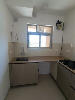 Kitchen in 1 BHK Apartment at Hiranandani Estate Solitaire C, Ghodbunder Road – for Rent