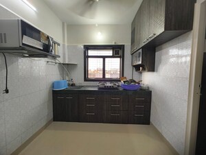 Kitchen in 1 BHK Apartment at Om Sadguru CHS, Ic Colony – for Sale