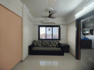 Living Room in 1 BHK Apartment at Om Sadguru CHS, Ic Colony – for Sale