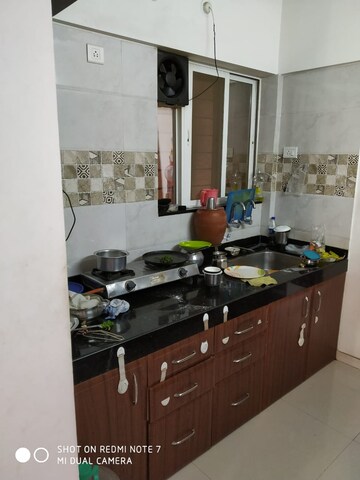 Kitchen in 3 BHK Apartment at Associated Sai Smruti, Dahanukar Colony – for Sale