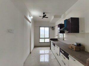 Kitchen in 2 BHK Apartment at Puranik Rumah Bali, Ghodbunder Road – for Rent