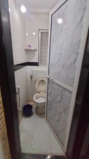 Bathroom in 1 BHK Apartment at Lok Upvan I, Manpada – for Rent