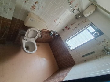 Bathroom in 2 BHK Apartment at Neptune Living Point, Bhandup West – for Rent