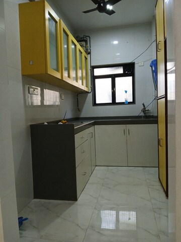 Kitchen in 2 BHK Apartment at Oshiwara Avalon CHS, Andheri West – for Rent