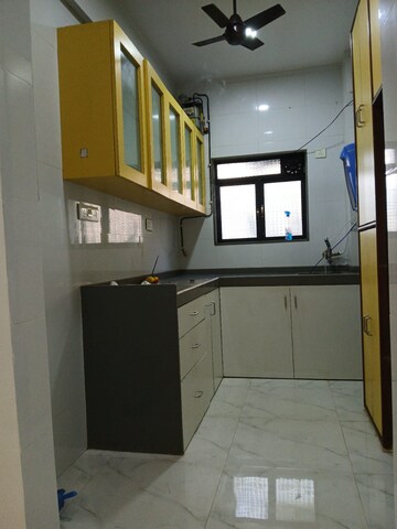 Kitchen in 2 BHK Apartment at Oshiwara Avalon CHS, Andheri West – for Rent