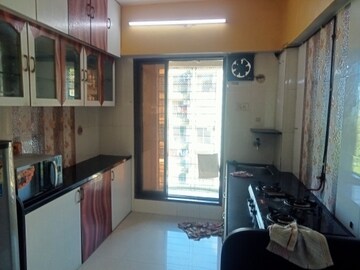 Kitchen in 2 BHK Apartment at Unique Garden, Mira Road East – for Rent