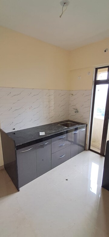 Kitchen in 1 BHK Apartment at Ram Pushpanjali Residency, Owale – for Sale
