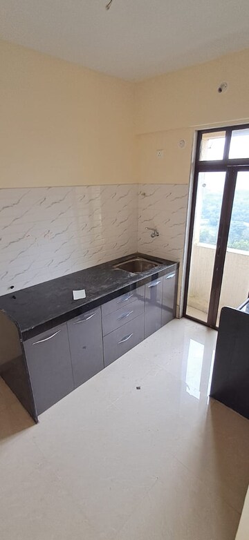 Kitchen in 1 BHK Apartment at Ram Pushpanjali Residency, Owale – for Sale