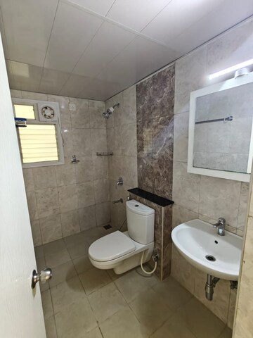 Bathroom in 3 BHK Apartment at Mantri Webcity, Hennur – for Rent