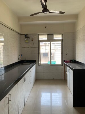 Kitchen in 2 BHK Apartment at Amar Jyoti Tower, Borivali West – for Sale