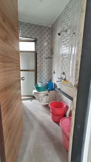 Bathroom in 1 BHK Apartment at Yashraj Park CHS, Kasarvadavali – for Rent