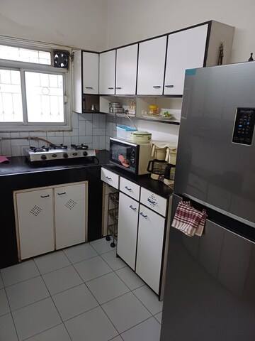 Kitchen in 1 BHK Apartment at New Rajendra Apartment CHS, Mahim – for Sale