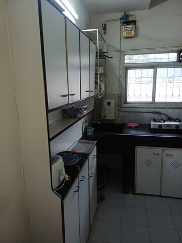 Kitchen in 1 BHK Apartment at New Rajendra Apartment CHS, Mahim – for Sale