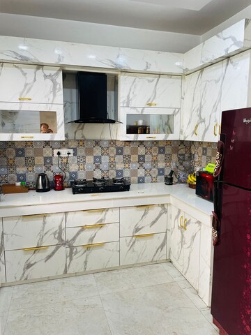 Kitchen in 3 BHK Apartment at Uninav Bliss, Raj Nagar Extension – for Sale