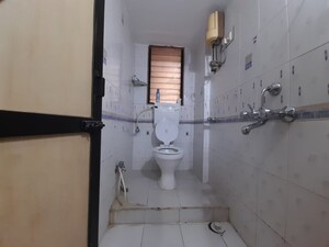Bathroom in 2 BHK Apartment at Nav Joytiling CHS, Goregaon East – for Rent
