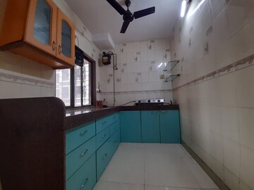 Kitchen in 2 BHK Apartment at Nav Joytiling CHS, Goregaon East – for Rent