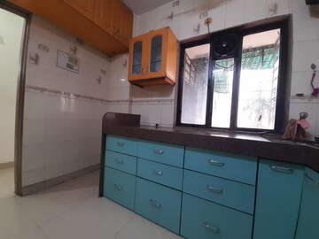 Kitchen in 2 BHK Apartment at Nav Joytiling CHS, Goregaon East – for Rent