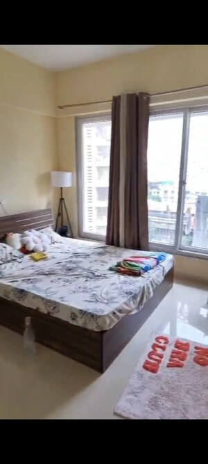 Bedroom in 1 BHK Apartment at Ruparel Elara, Kandivali West – for Rent