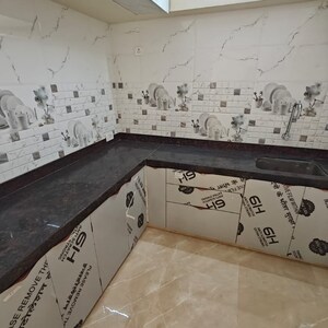 Kitchen in 2 BHK Apartment at Triumph Omkareshwar CHS, Food Corporation Of India Warehouse – for Rent