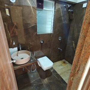 Bathroom in 2 BHK Apartment at Triumph Omkareshwar CHS, Food Corporation Of India Warehouse – for Rent