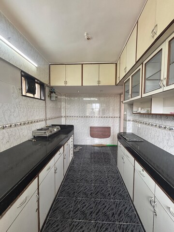 Kitchen in 2 BHK Apartment at Rose Apartment Juhu, Juhu – for Rent