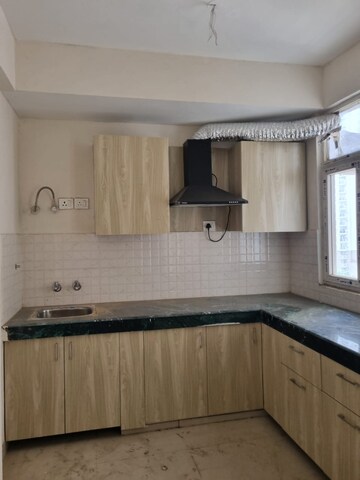 Kitchen in 2 BHK Apartment at Shree Vardhman Green Court, Sector 90 – for Rent