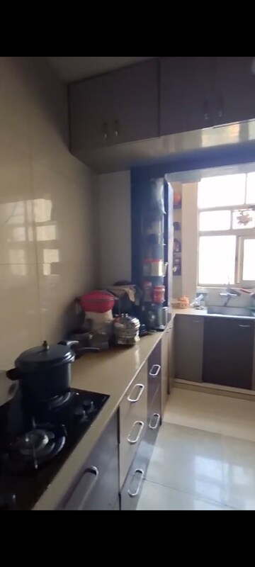 Kitchen in 2 BHK Apartment at Rodas Enclave Woodstock, Patlipada – for Rent